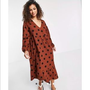 Brand new smock dress with long sleeves and tiered hem in brown and black spot